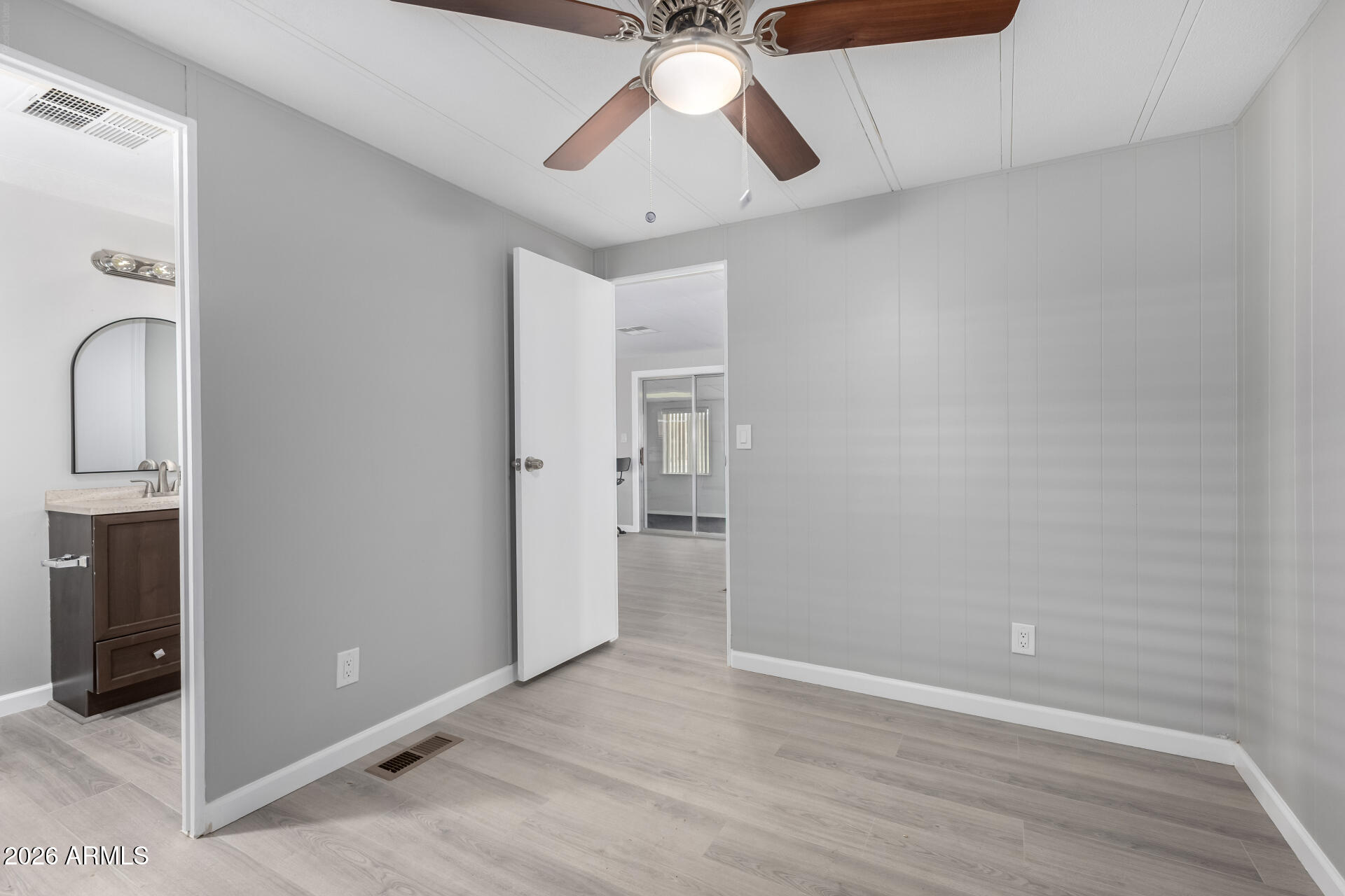 3104 East Broadway Road, Unit 30 Mesa, AZ 85204 - Photo 18 of 28 a view of empty room with ceiling fan