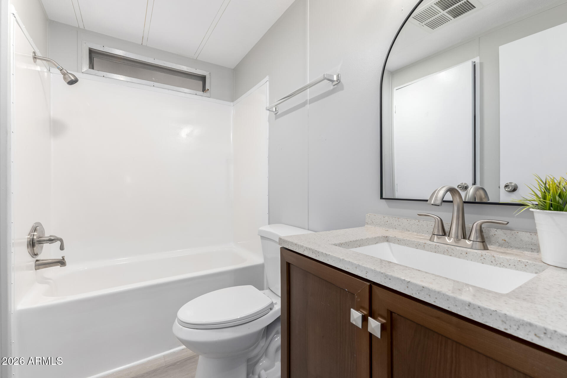 3104 East Broadway Road, Unit 30 Mesa, AZ 85204 - Photo 19 of 28 a bathroom with a granite countertop sink toilet and shower