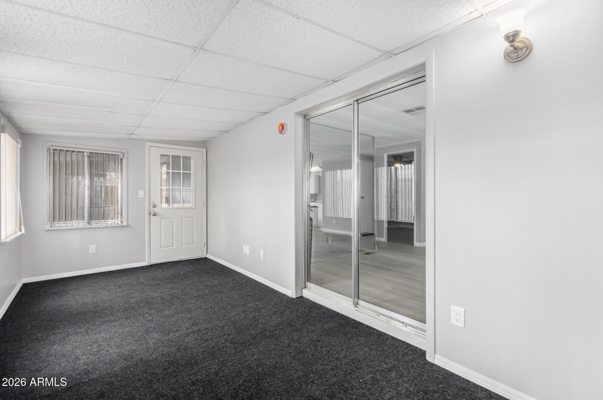 3104 East Broadway Road, Unit 30 Mesa, AZ 85204 - Photo 21 of 28 an empty room with windows
