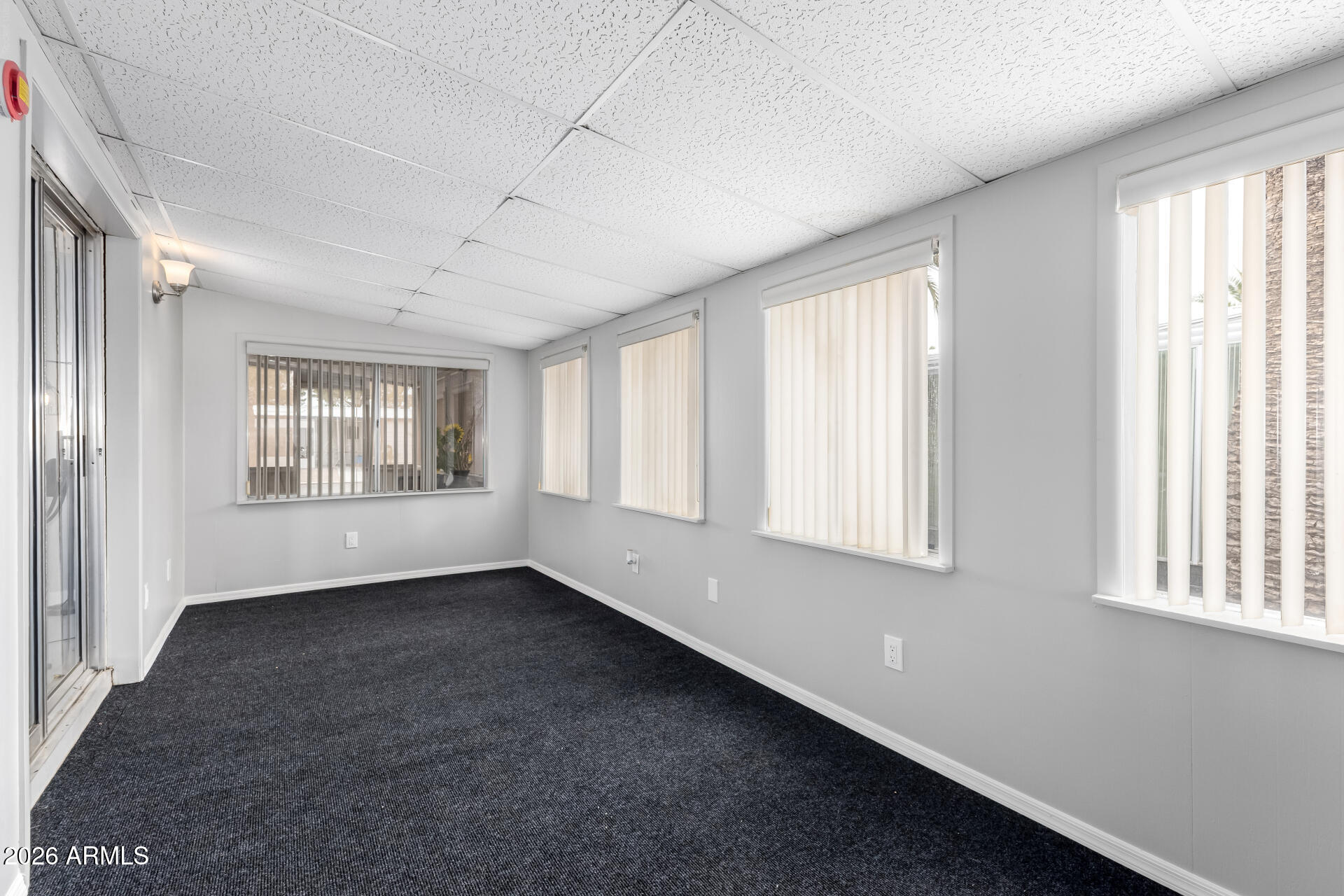 3104 East Broadway Road, Unit 30 Mesa, AZ 85204 - Photo 22 of 28 a view of an empty room with a window
