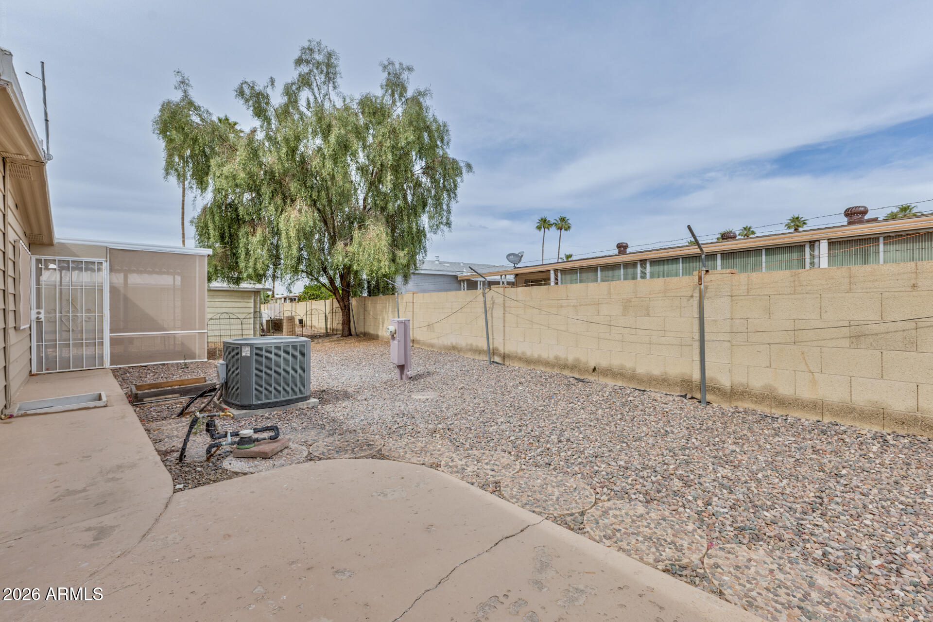 3104 East Broadway Road, Unit 30 Mesa, AZ 85204 - Photo 25 of 28 a view of a backyard with chairs