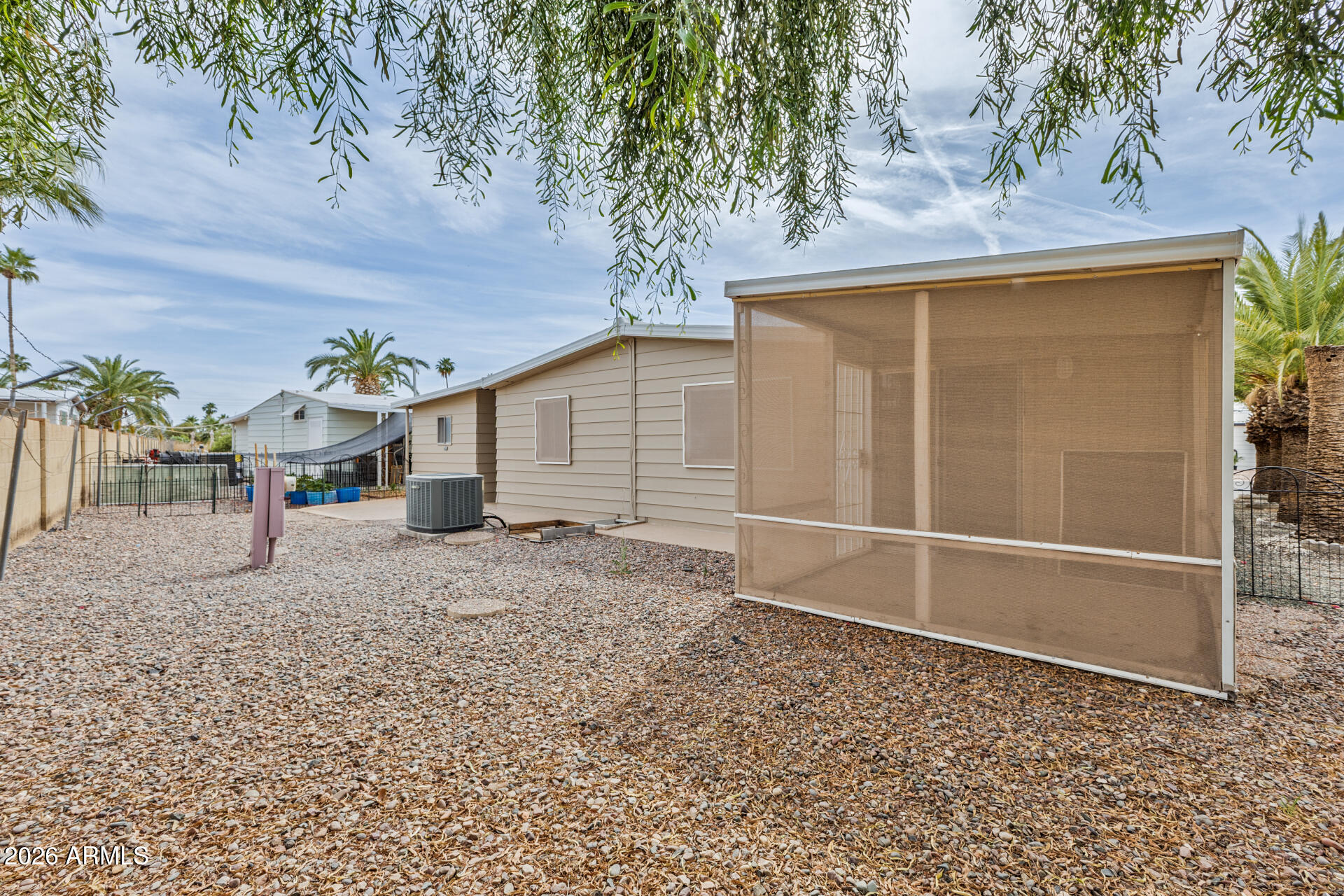 3104 East Broadway Road, Unit 30 Mesa, AZ 85204 - Photo 27 of 28 a white house with trees in front of it