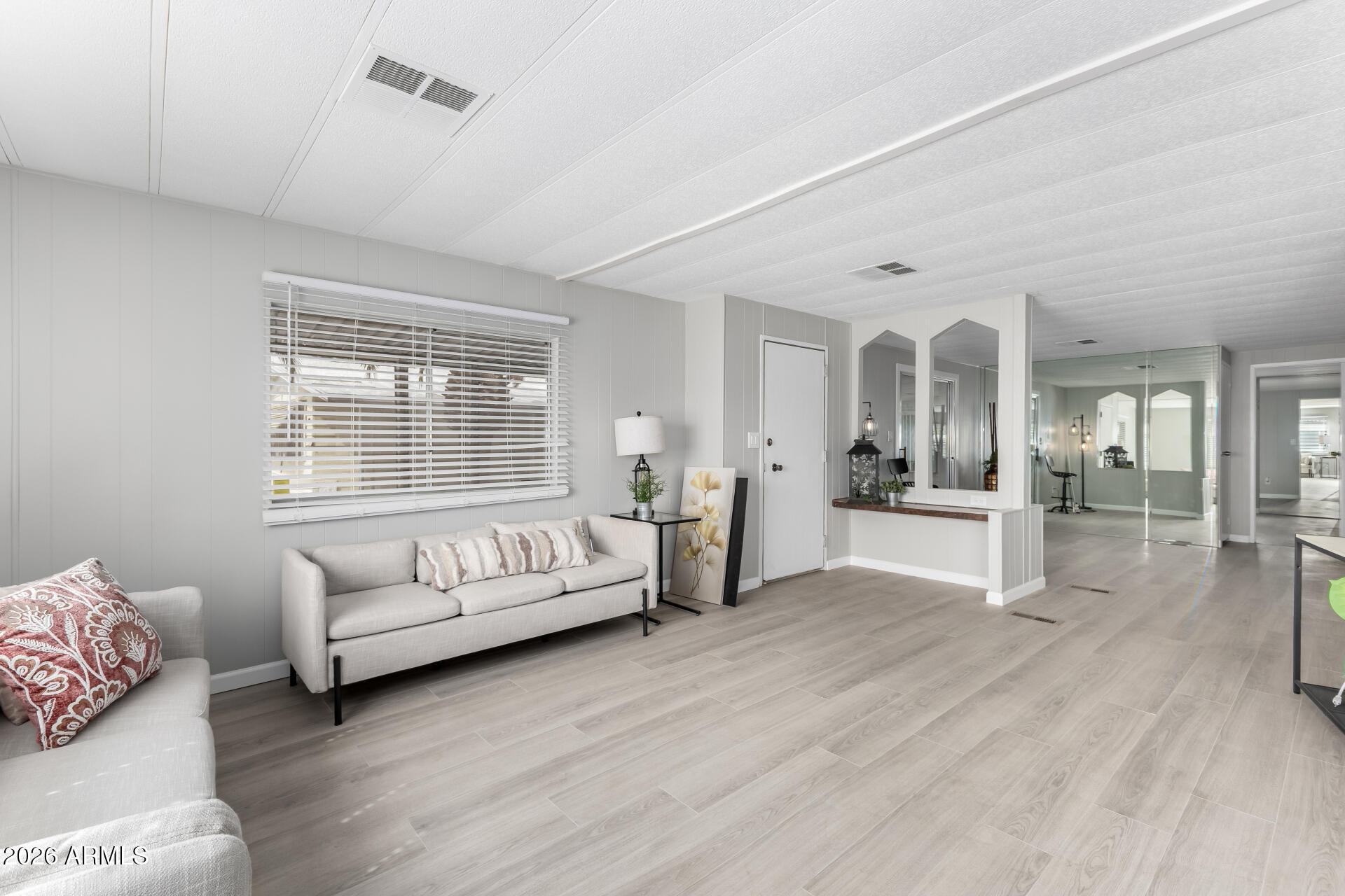 3104 East Broadway Road, Unit 30 Mesa, AZ 85204 - Photo 6 of 28 a living room with furniture and white walls