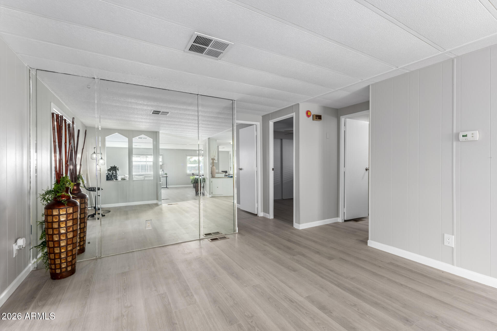 3104 East Broadway Road, Unit 30 Mesa, AZ 85204 - Photo 7 of 28 a view of a hallway with wooden floor