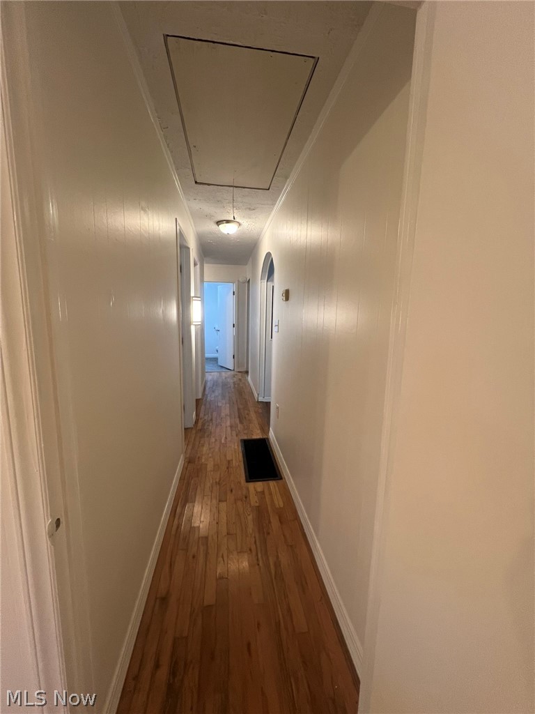 1105 Dutch Ridge Road Guysville, OH 45735 - Photo 24 of 33 Hallway featuring wood-finish flooring and light-toned walls