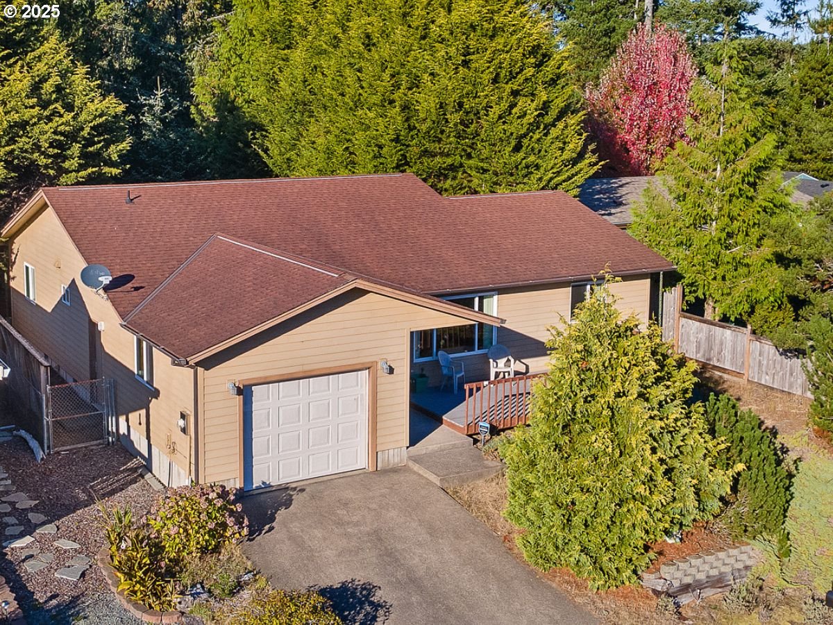 a aerial view of a house with a yard and garden