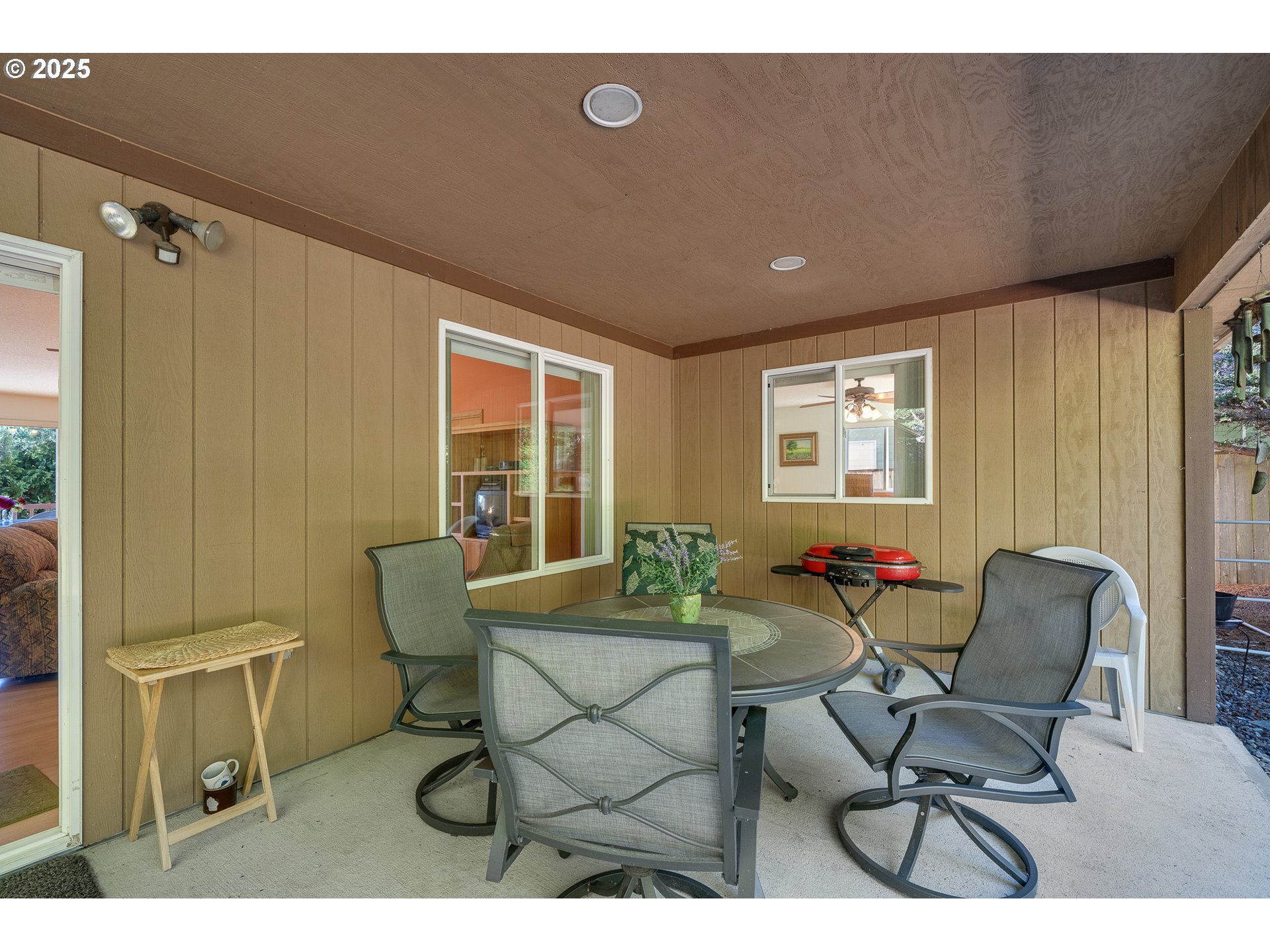 10750 Neptune Way Nehalem, OR 97131 - Photo 20 of 25 a outdoor living space with furniture and a window