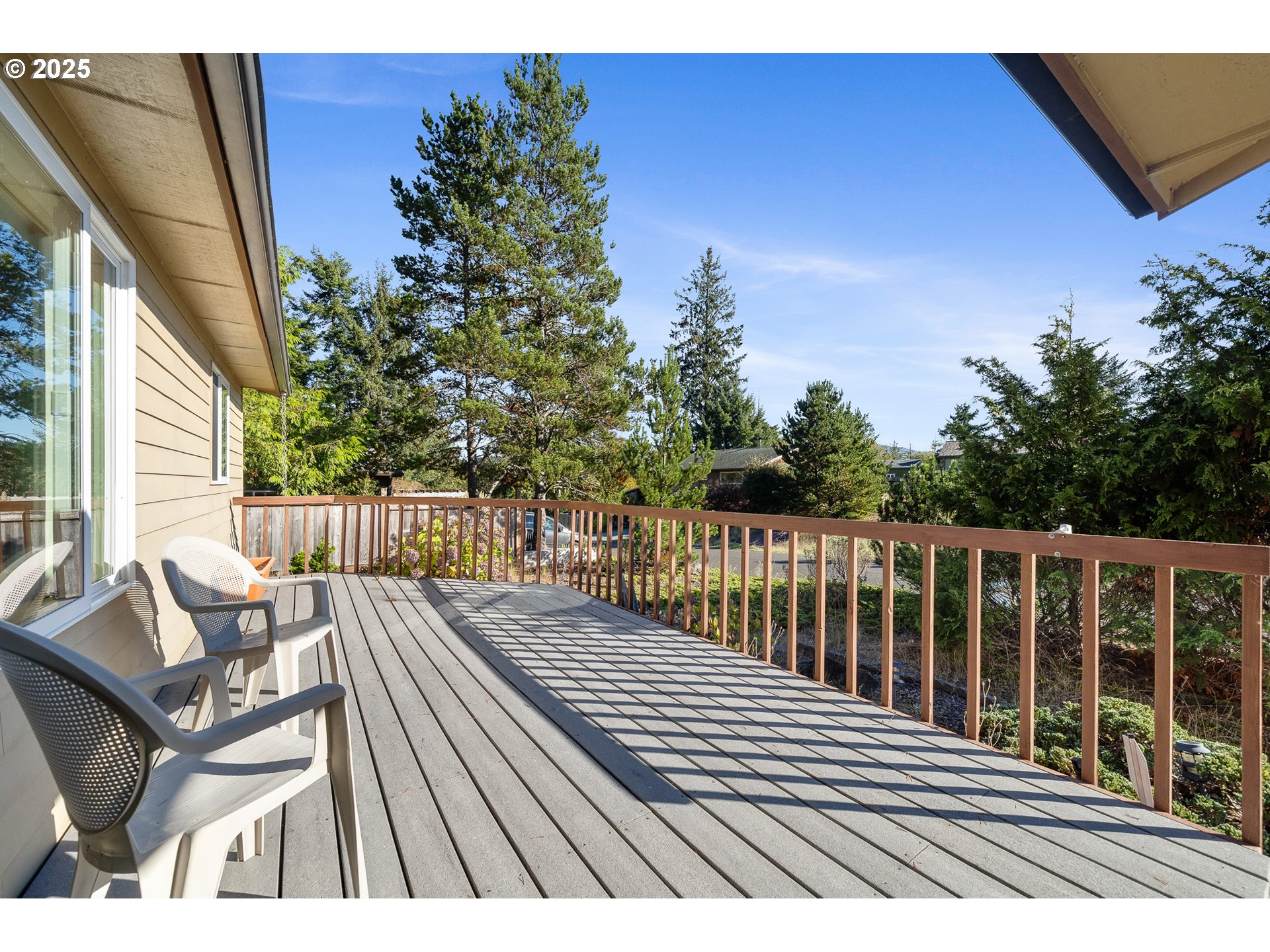 10750 Neptune Way Nehalem, OR 97131 - Photo 2 of 25 a view of balcony with wooden floor and seating space
