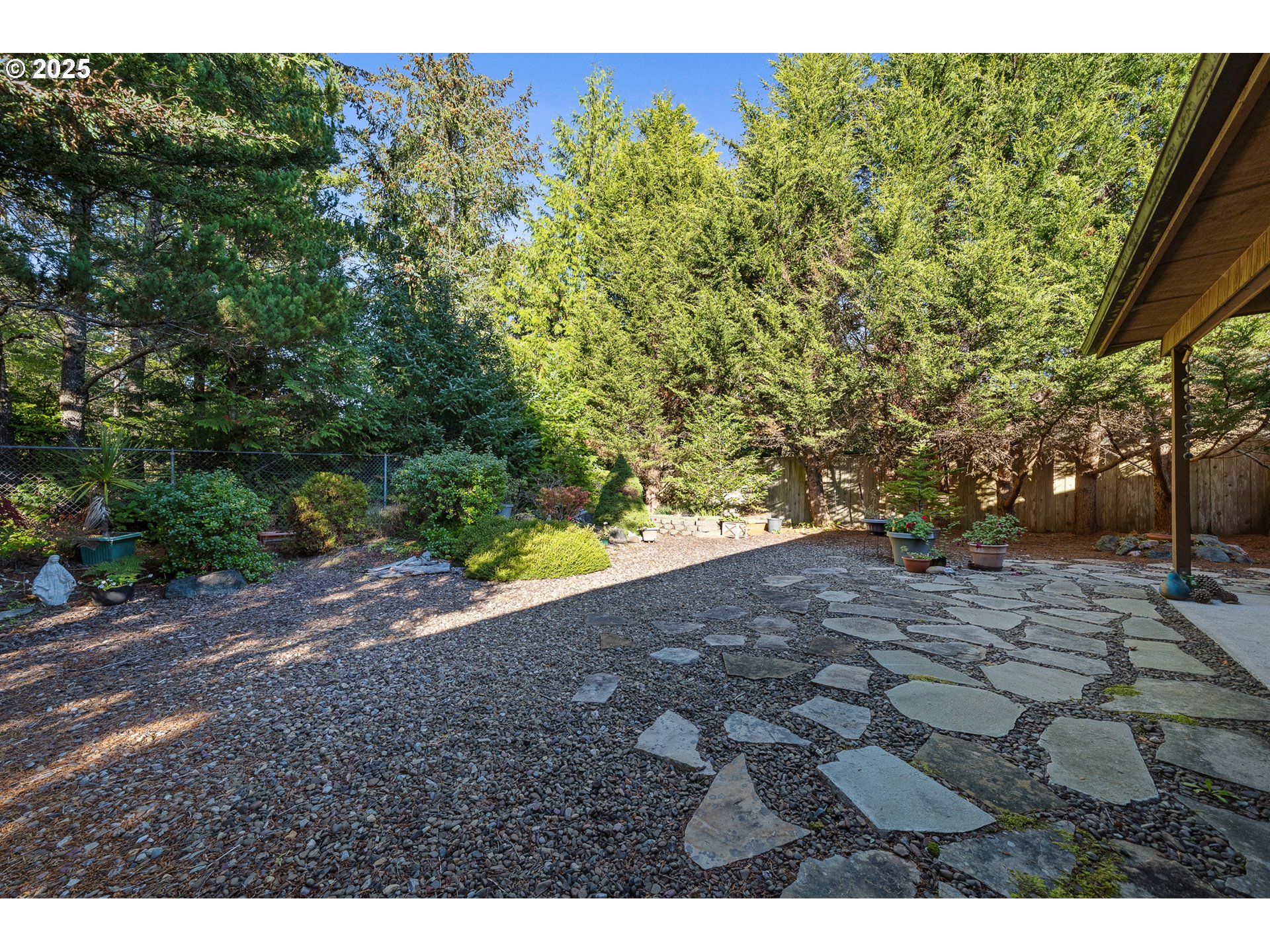 10750 Neptune Way Nehalem, OR 97131 - Photo 21 of 25 a view of a yard with plants and large trees