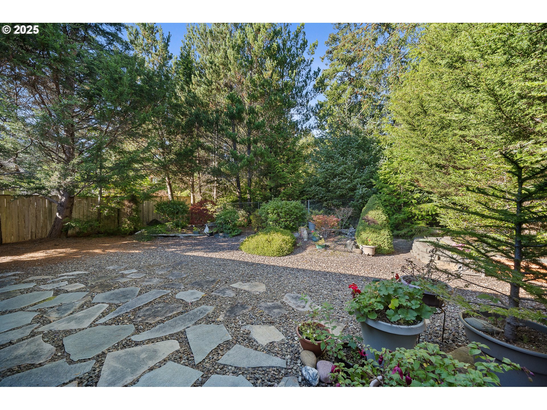 10750 Neptune Way Nehalem, OR 97131 - Photo 22 of 25 a view of a backyard of the house