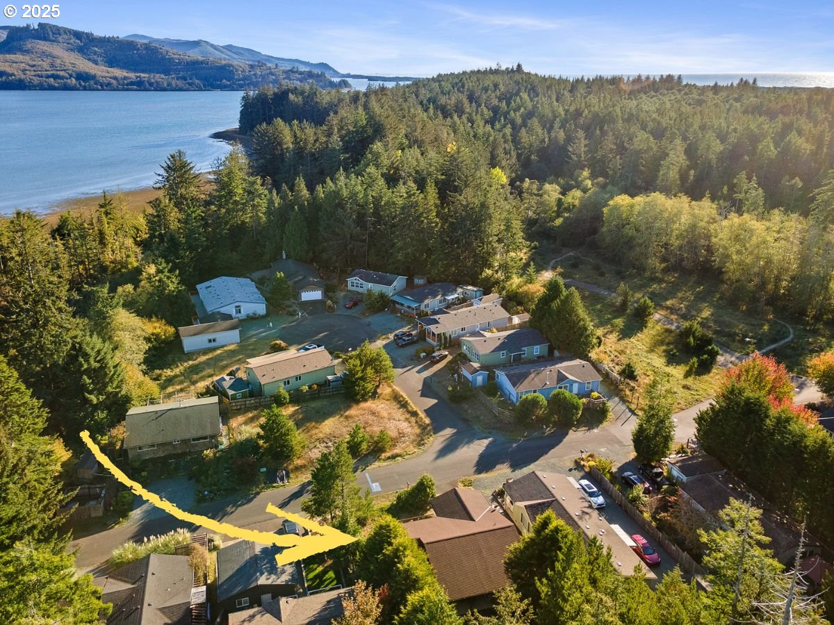 10750 Neptune Way Nehalem, OR 97131 - Photo 25 of 25 an aerial view of residential house with outdoor space and lake view