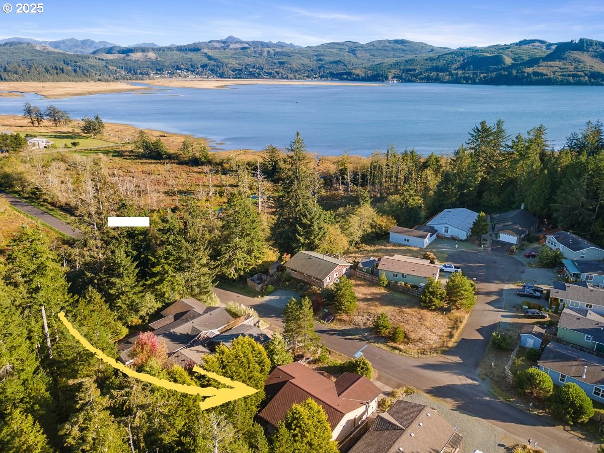 10750 Neptune Way Nehalem, OR 97131 - Photo 3 of 25 a picture of lake view and mountain view
