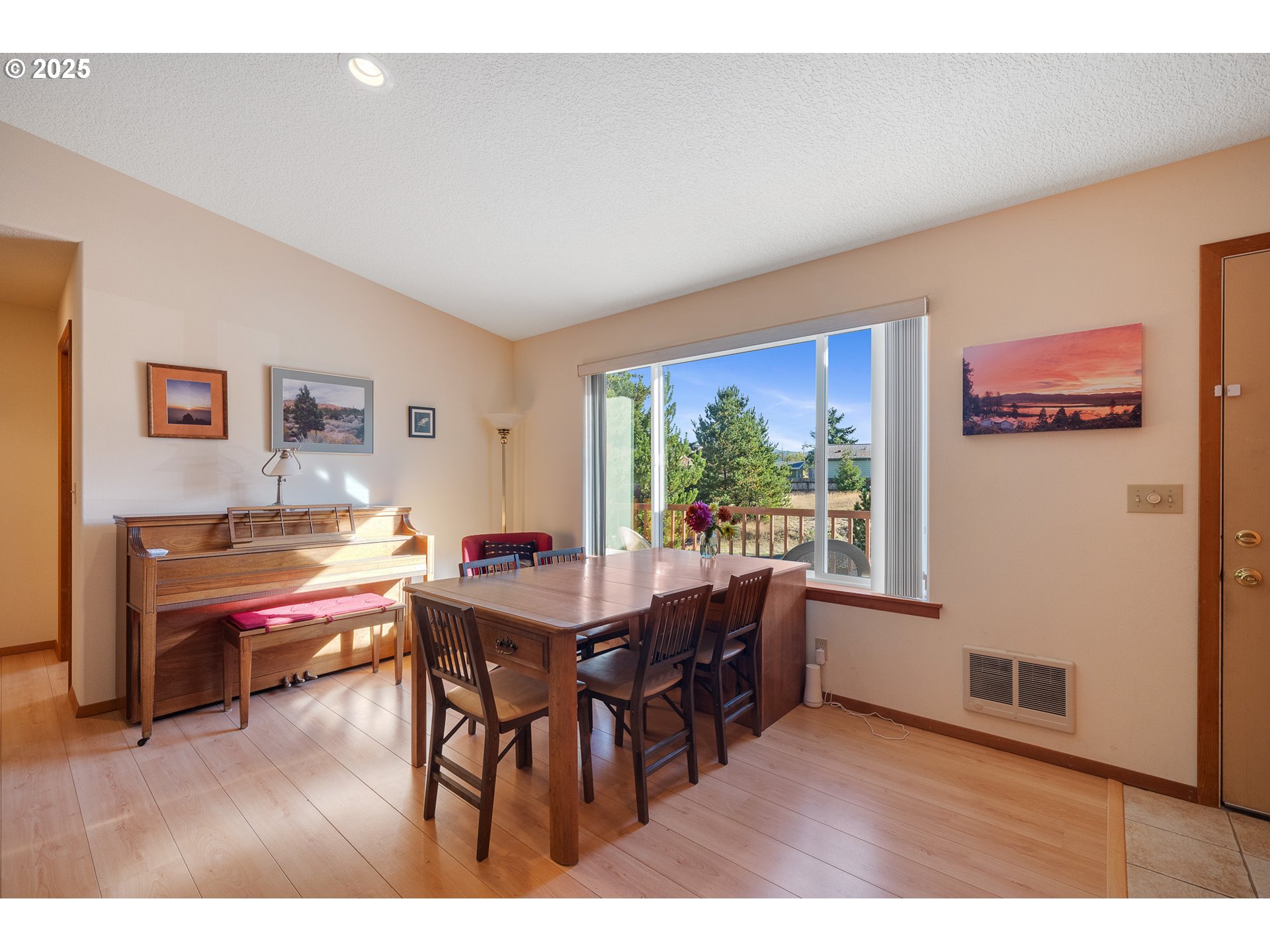 10750 Neptune Way Nehalem, OR 97131 - Photo 5 of 25 a view of a dining room with furniture window and wooden floor