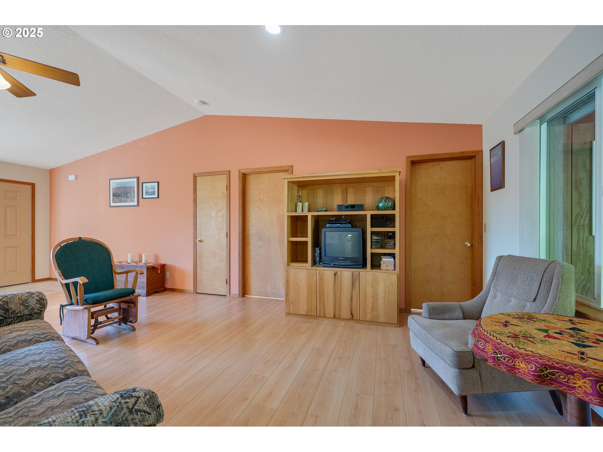 10750 Neptune Way Nehalem, OR 97131 - Photo 7 of 25 a living room with furniture and wooden floor