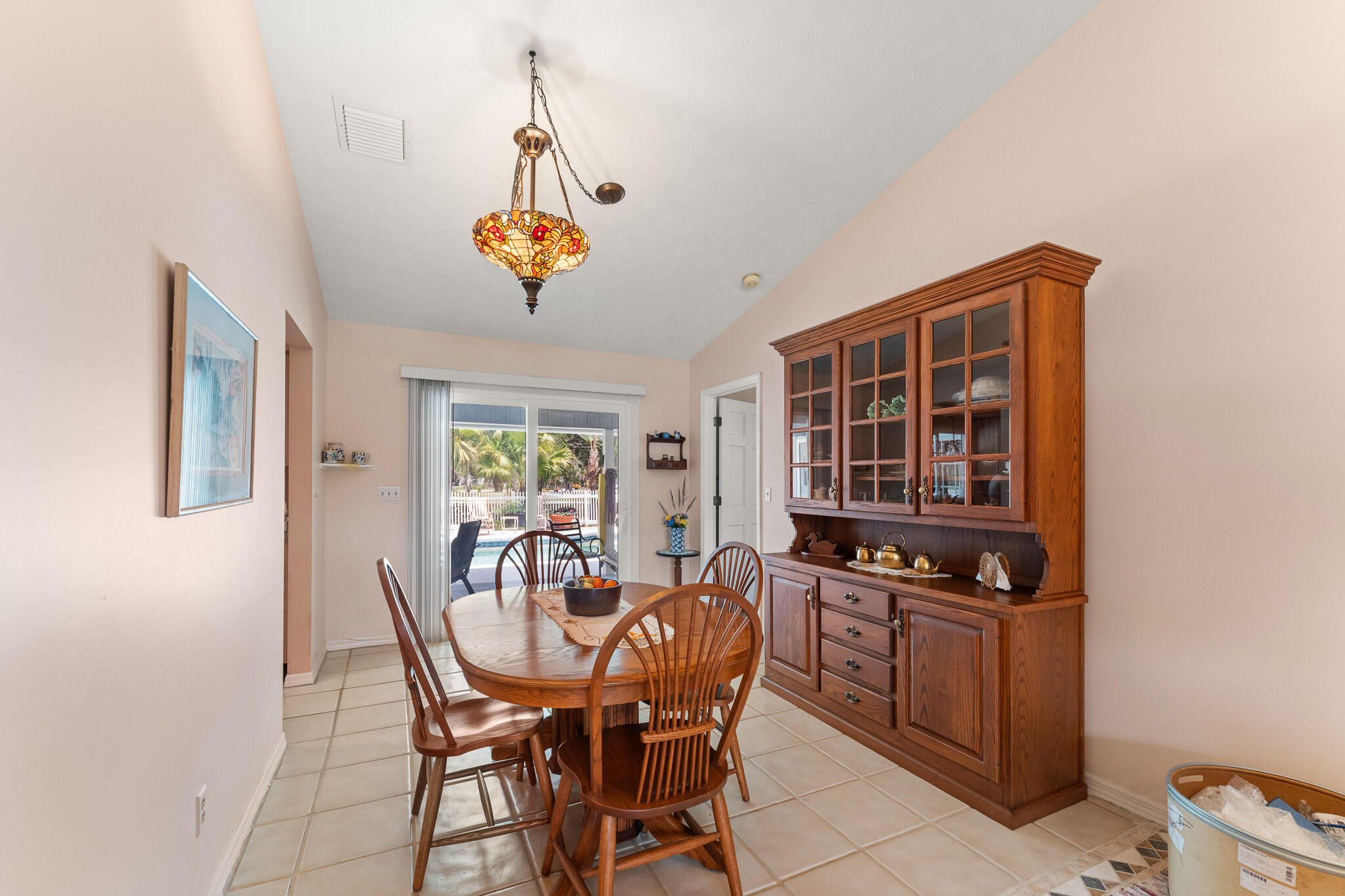 1653 Southwest 85th Terrace Stuart, FL 34997 - Photo 14 of 54 a dining room with furniture and window