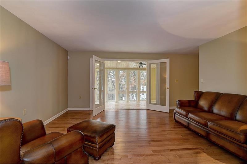 163 Glen Rape Road Rochester, PA 15074 - Photo 11 of 25 Nice-sized Living Room View with Wood Floors and double doors that open to the 4 seasons porch.