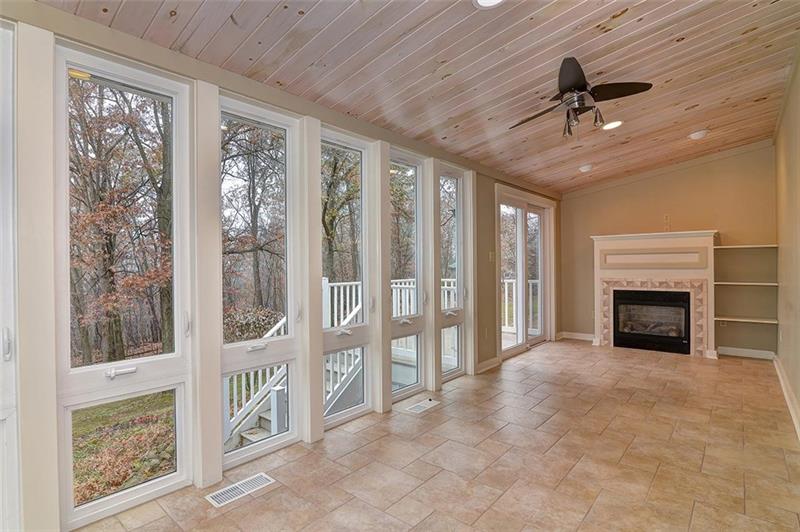 163 Glen Rape Road Rochester, PA 15074 - Photo 13 of 25 AMAZING windowed 4 Seasons Rm overlooks woodlands has French Doors, gas Fireplace & heated floor.