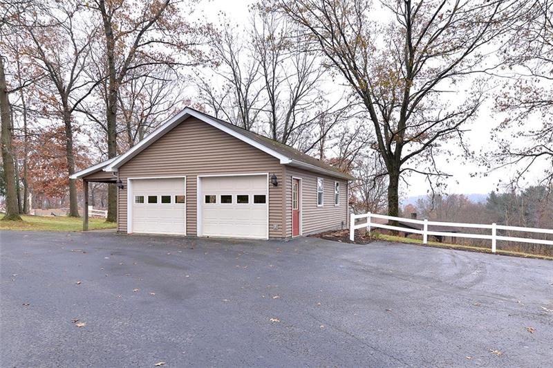 163 Glen Rape Road Rochester, PA 15074 - Photo 4 of 25 DETACHED 2.5 car garage built in 2000 w/ elec/heat/water/floored attic/man door(s) & Covered patio area.
