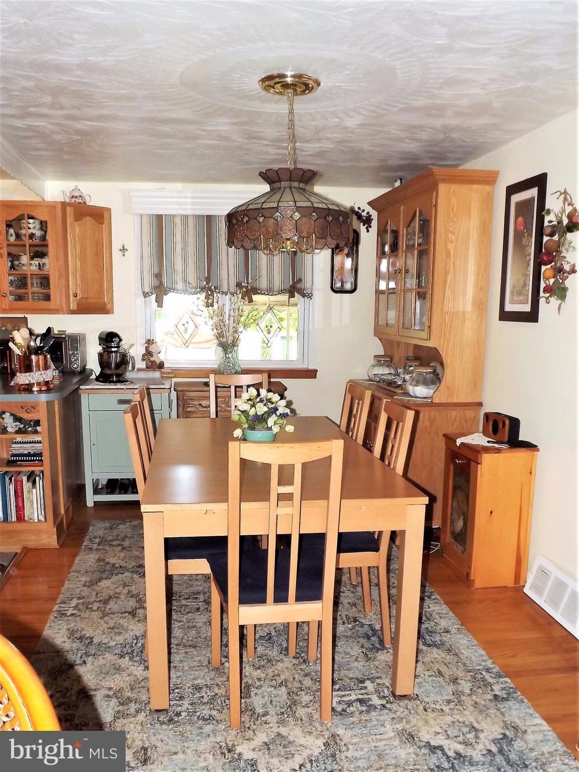 7357 Edsworth Road Baltimore, MD 21222 - Photo 16 of 30 Large dining room is open to the kitchen.
