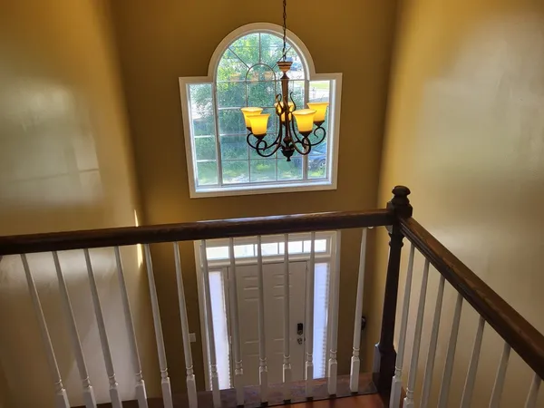 a view of staircase with mirror