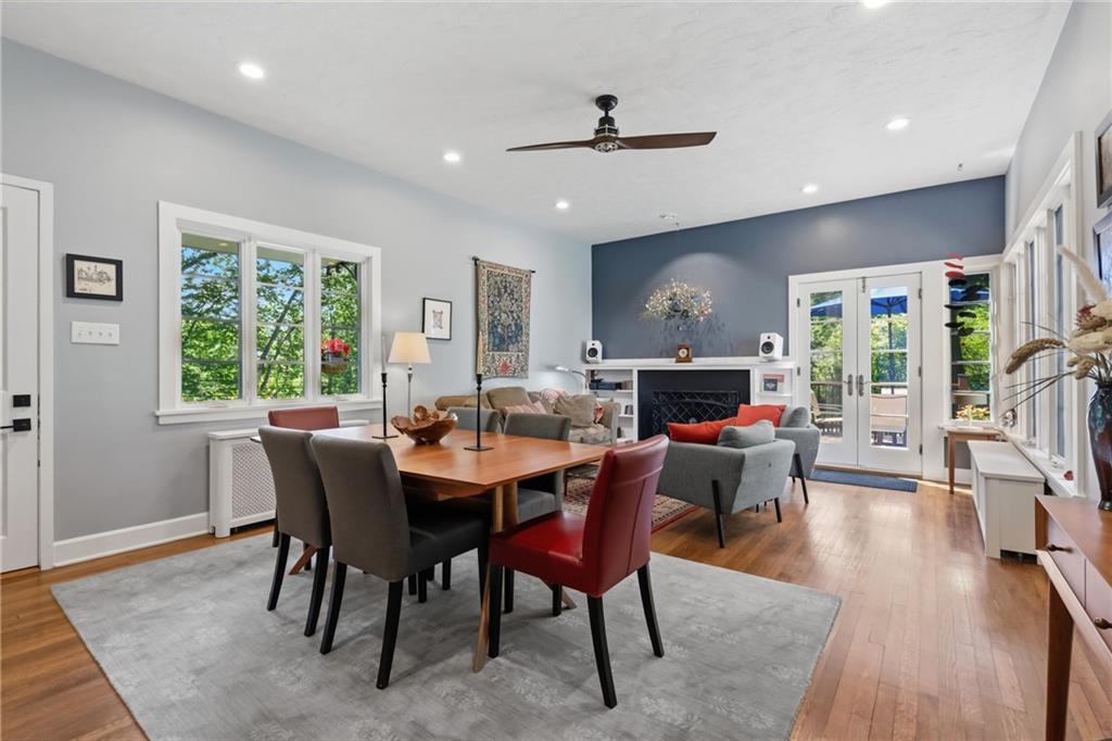 Large windows and glass French doors allow so much natural light into the space.