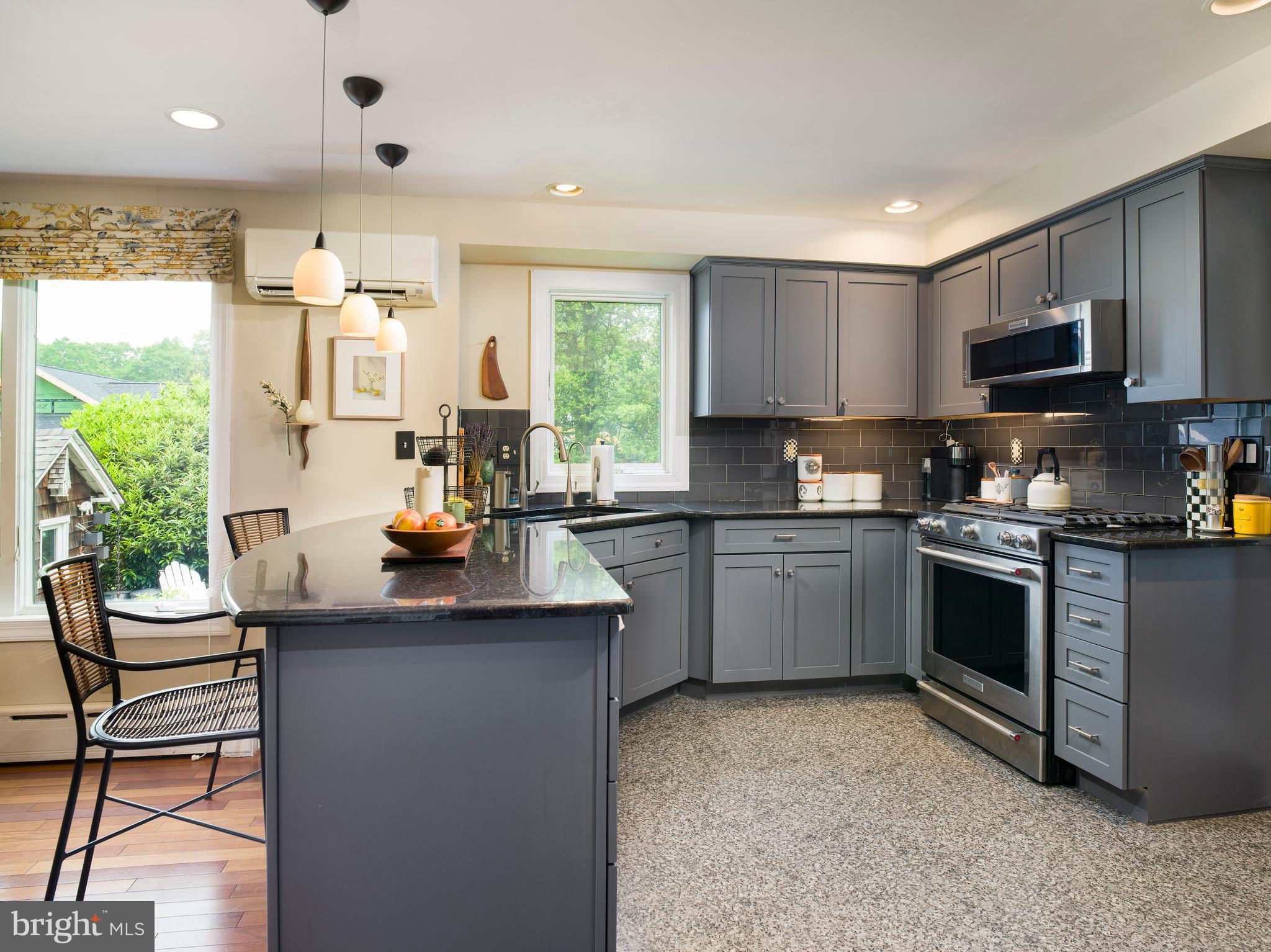 442 Old Eagle School Road Wayne, PA 19087 - Photo 12 of 39 a kitchen with kitchen island granite countertop a sink counter top space appliances and a window