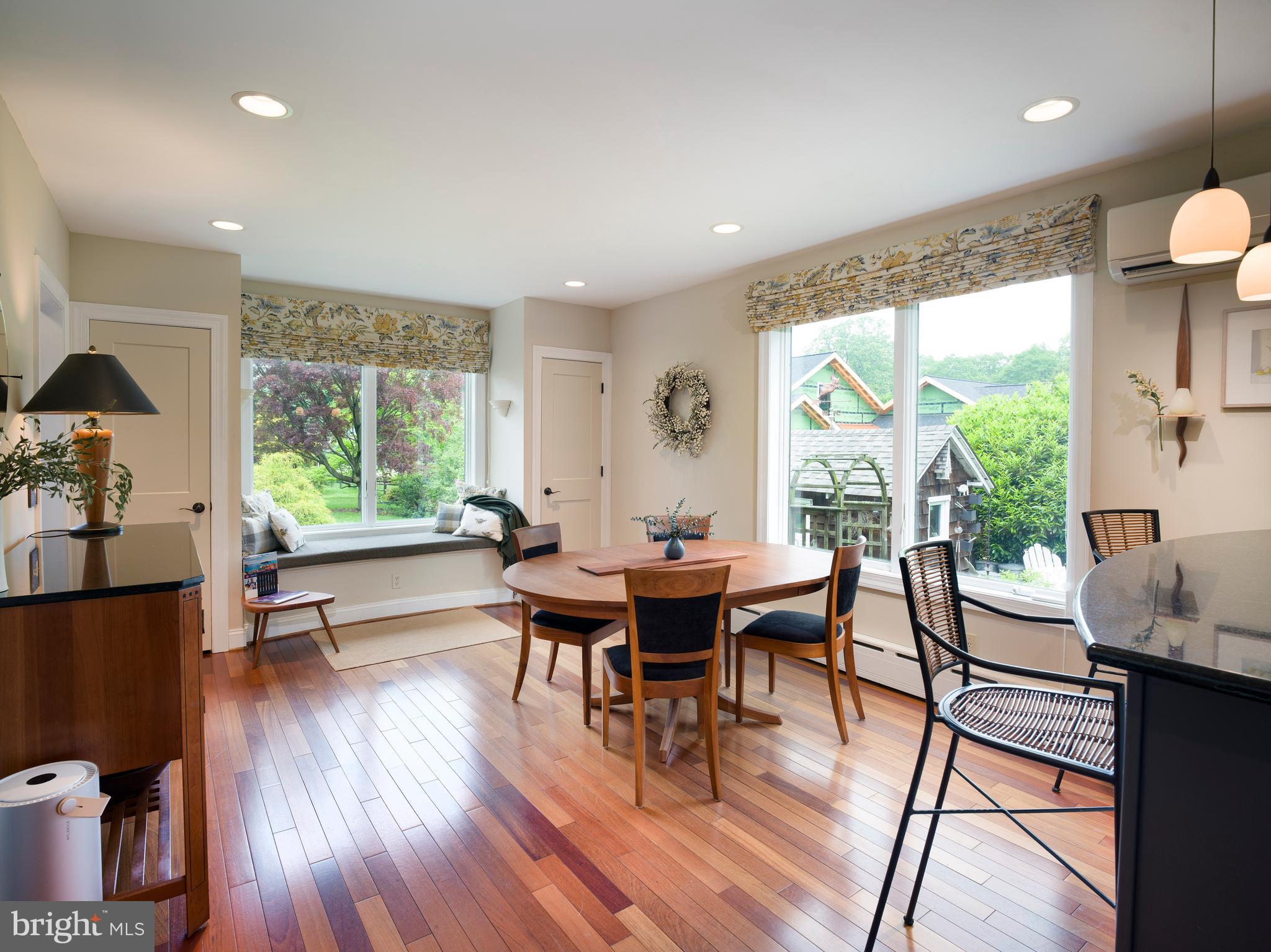 442 Old Eagle School Road Wayne, PA 19087 - Photo 17 of 39 a dining room with wooden floor and a floor to ceiling window