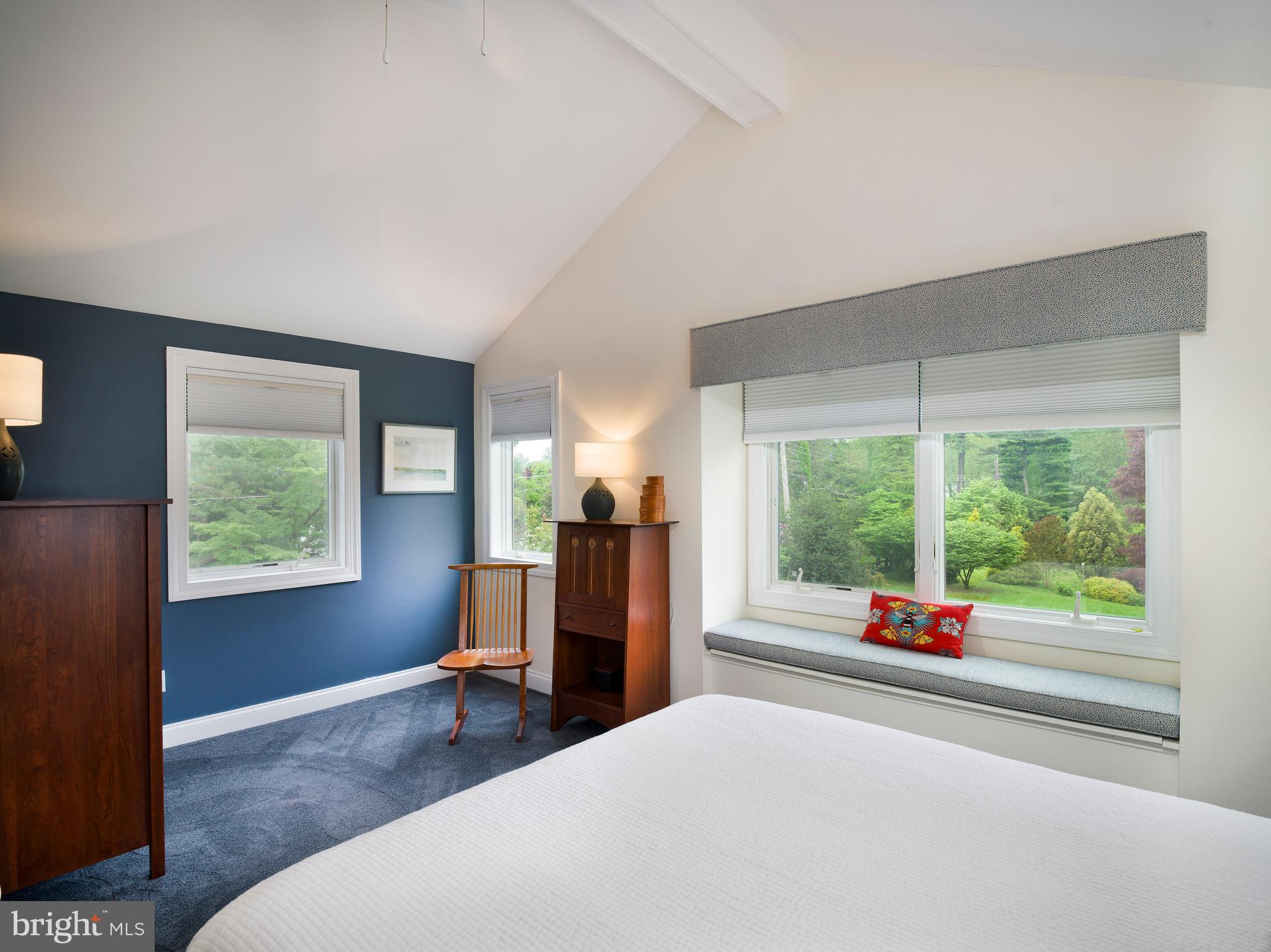 442 Old Eagle School Road Wayne, PA 19087 - Photo 23 of 39 a bedroom with a bed and a large window with outer view
