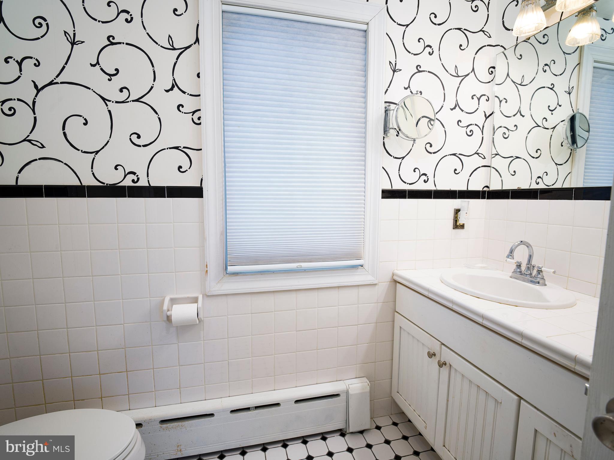442 Old Eagle School Road Wayne, PA 19087 - Photo 25 of 39 a bathroom with a sink and a mirror