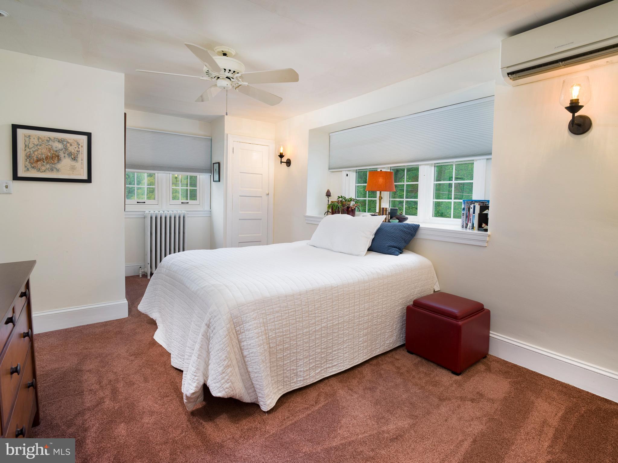 442 Old Eagle School Road Wayne, PA 19087 - Photo 27 of 39 a bedroom with a bed and a chandelier