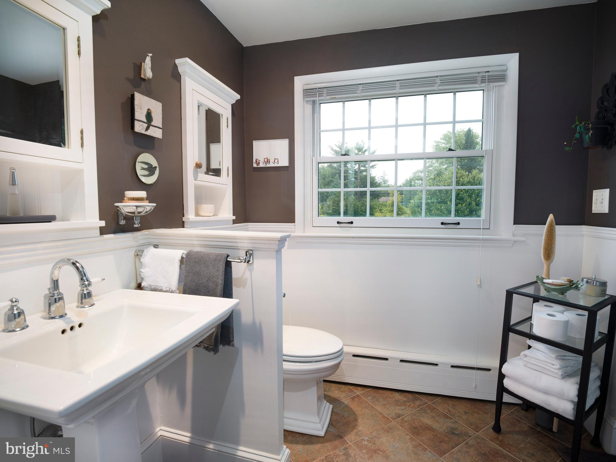 442 Old Eagle School Road Wayne, PA 19087 - Photo 30 of 39 a bathroom with a sink a toilet and a window