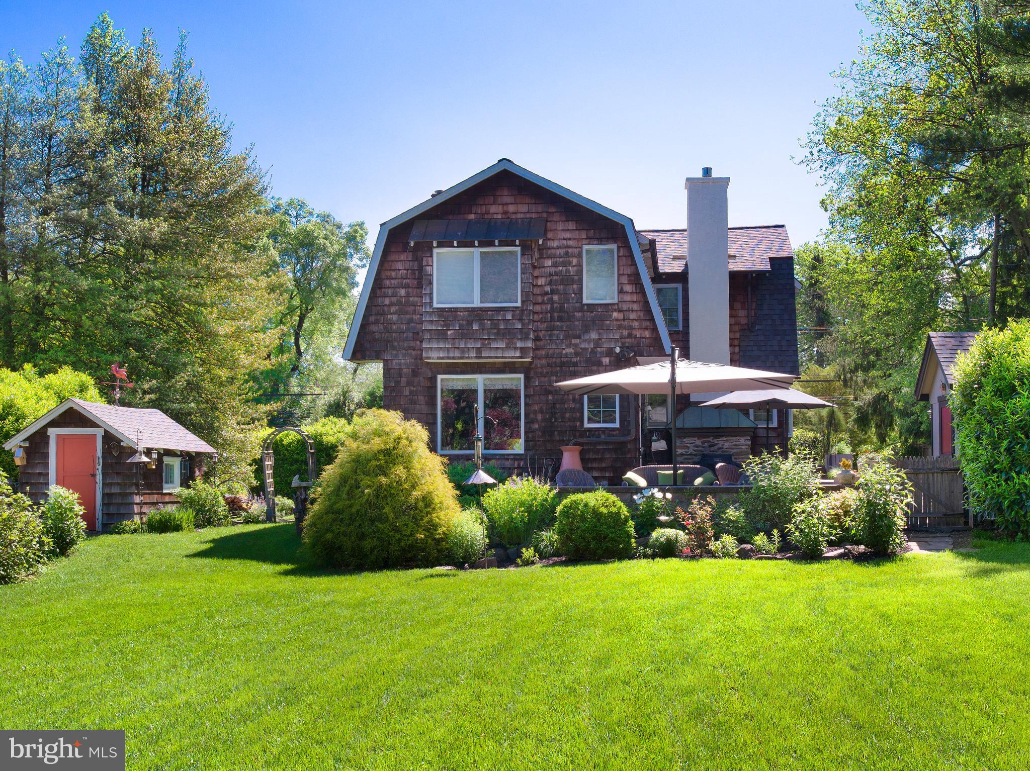 442 Old Eagle School Road Wayne, PA 19087 - Photo 34 of 39 a front view of a house with a garden and plants