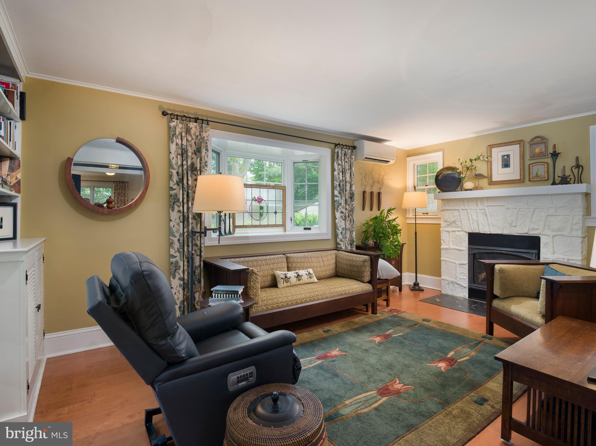 442 Old Eagle School Road Wayne, PA 19087 - Photo 8 of 39 a living room with furniture and a fireplace