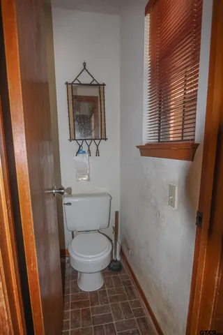 a bathroom with a toilet and a sink