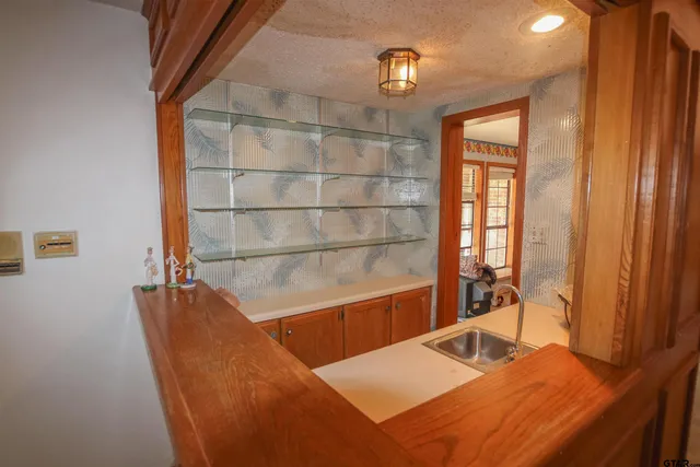 a view of a living room with furniture and a window