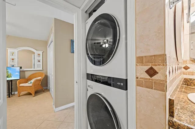 a view of a bedroom with washer and dryer
