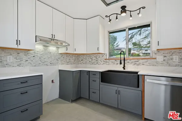a view of an empty room with windows