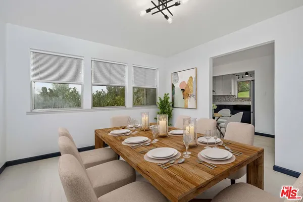 a view of livingroom with furniture and workspace