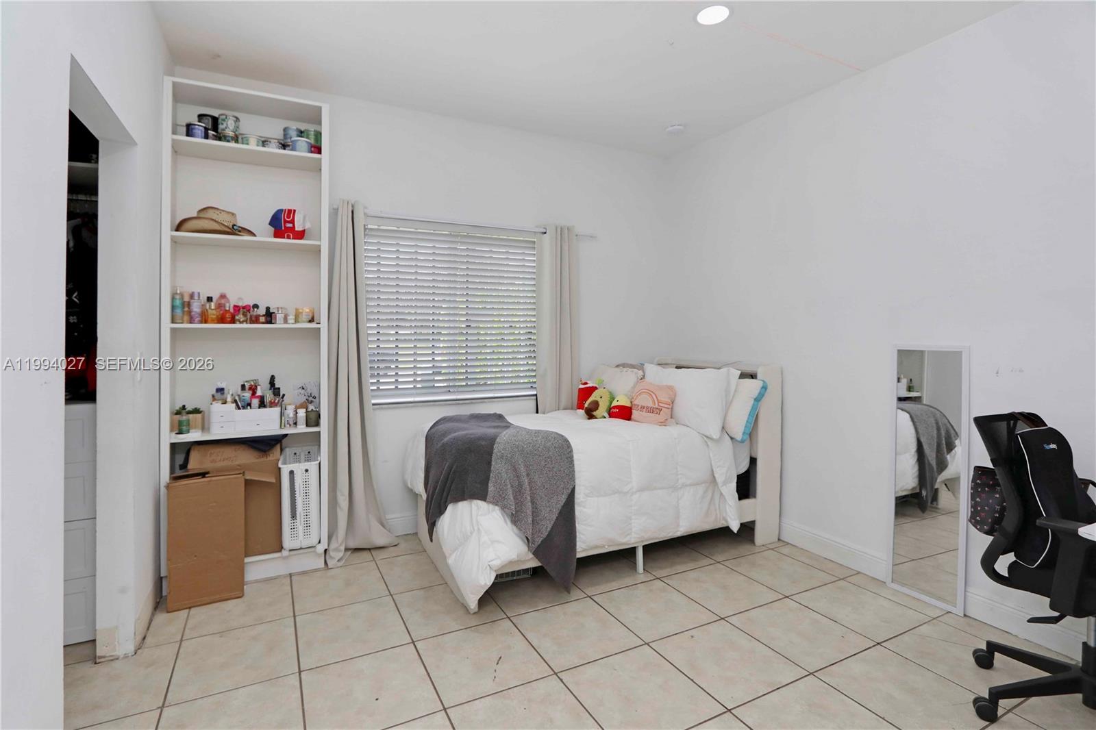 12245 Southwest 218th Street Miami, FL 33170 - Photo 16 of 32 a living room with furniture and a window