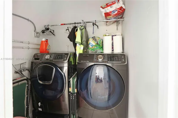 a utility room with dryer and washer