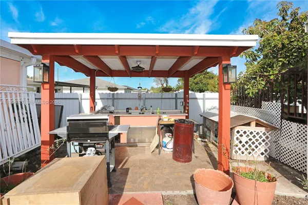 a outdoor living space with patio furniture and potted plants