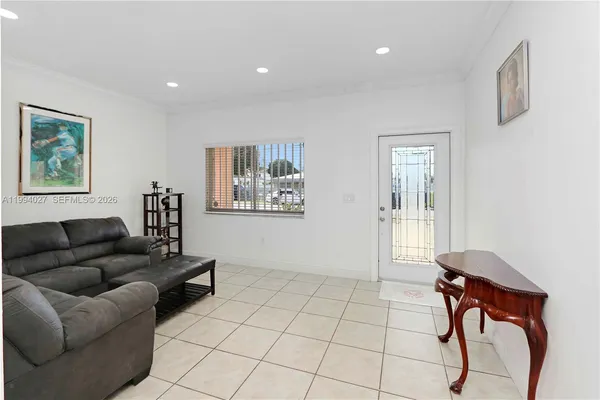 a living room with furniture and a window