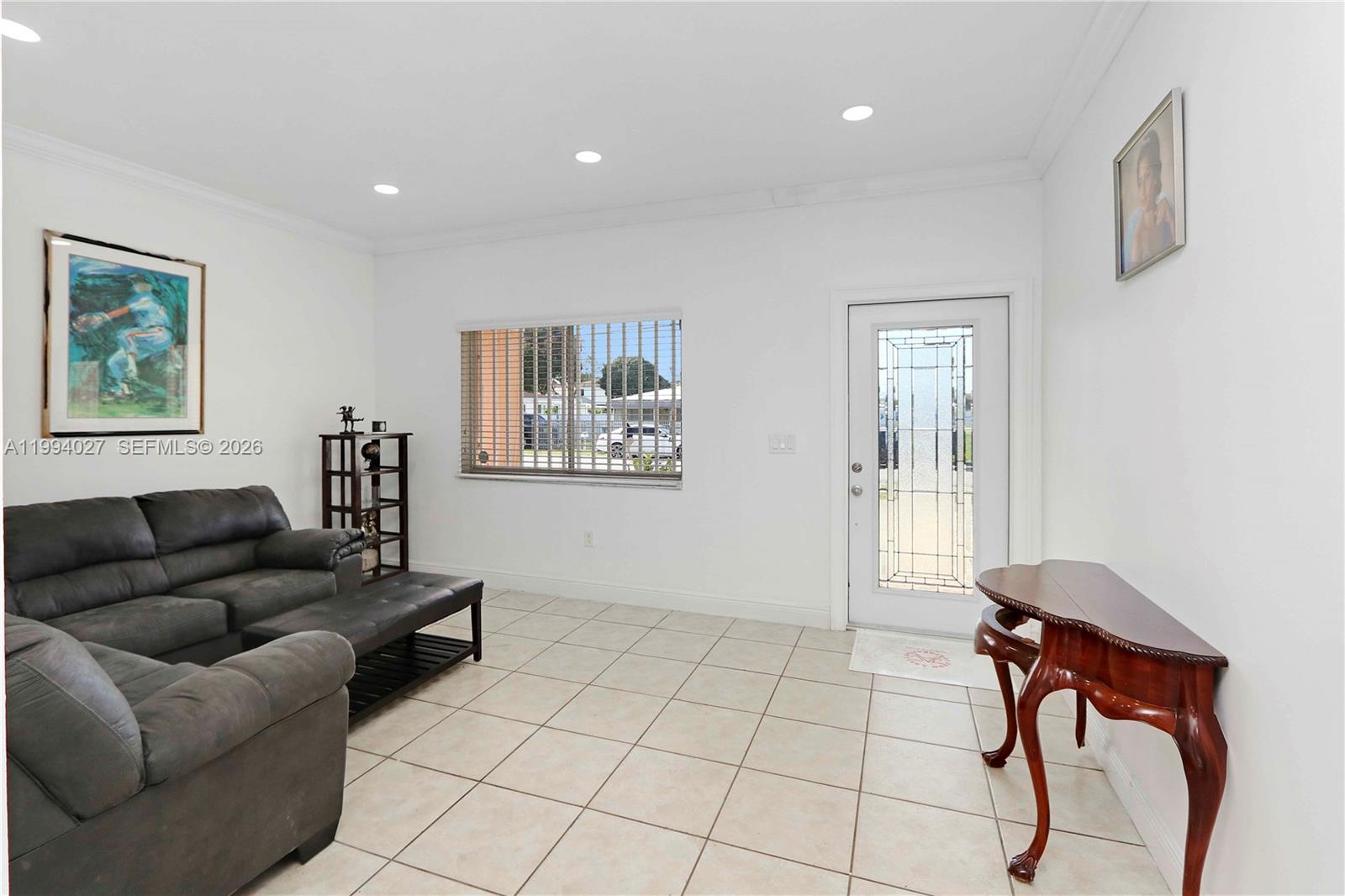 12245 Southwest 218th Street Miami, FL 33170 - Photo 5 of 32 a living room with furniture and a window