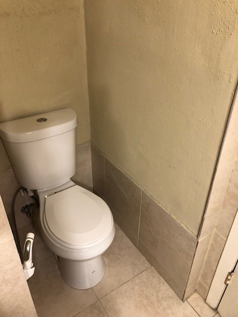 1901 South Voss Road, Unit 61 Houston, TX 77057 - Photo 16 of 22 a white toilet sitting next to a shower