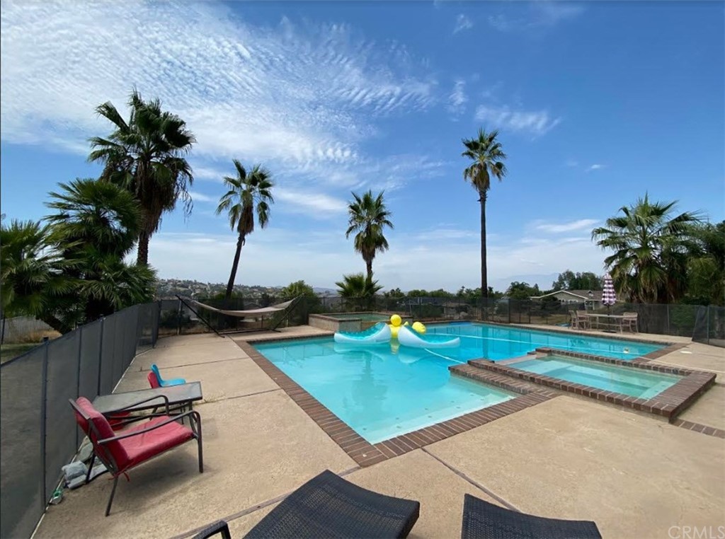 16391 Sally Lane Riverside, CA 92504 - Photo 1 of 1 a view of a backyard with swimming pool and sitting area