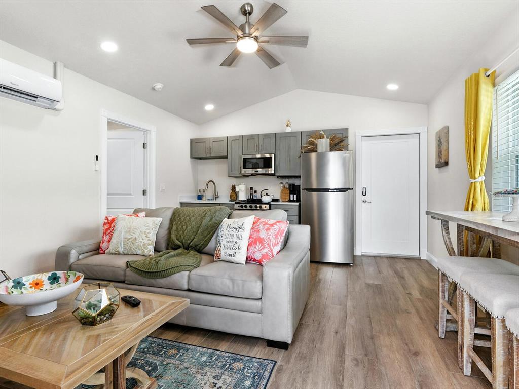 544 Canal Road Sarasota, FL 34242 - Photo 12 of 35 a living room with furniture and kitchen view