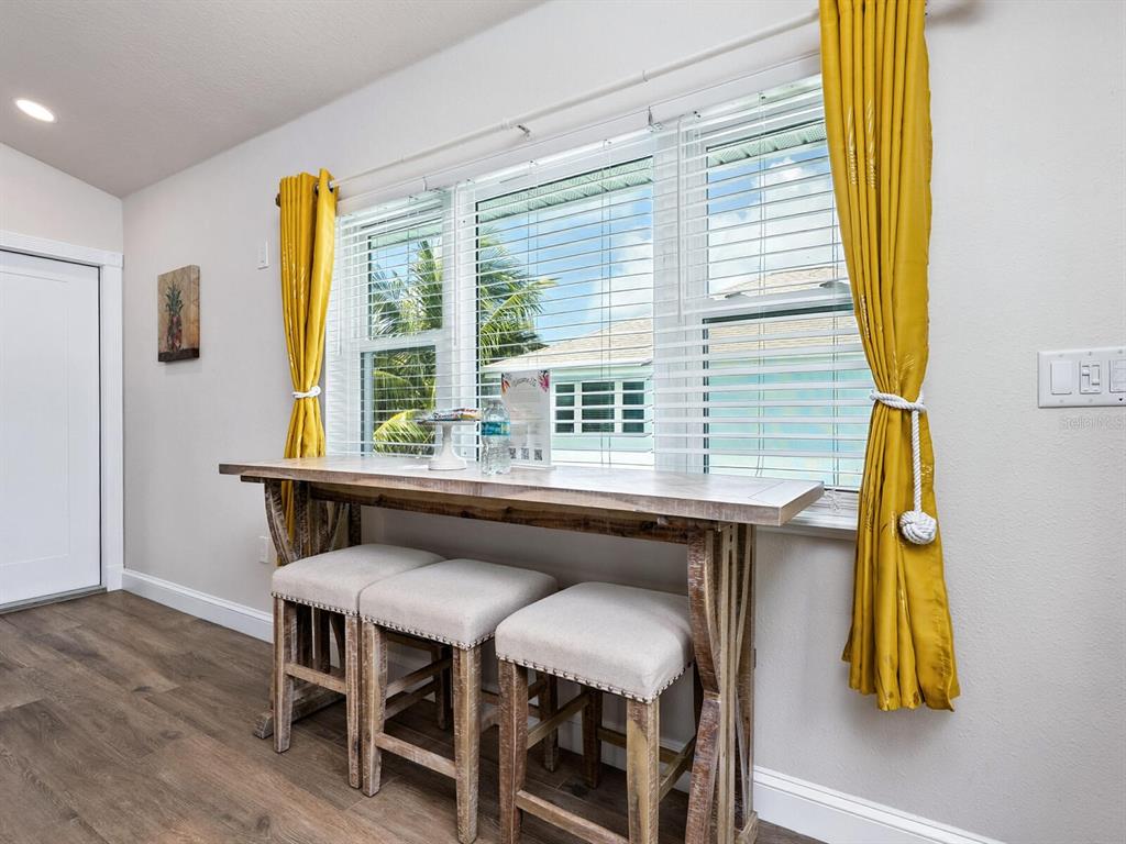 544 Canal Road Sarasota, FL 34242 - Photo 13 of 35 a dining room with furniture and a window