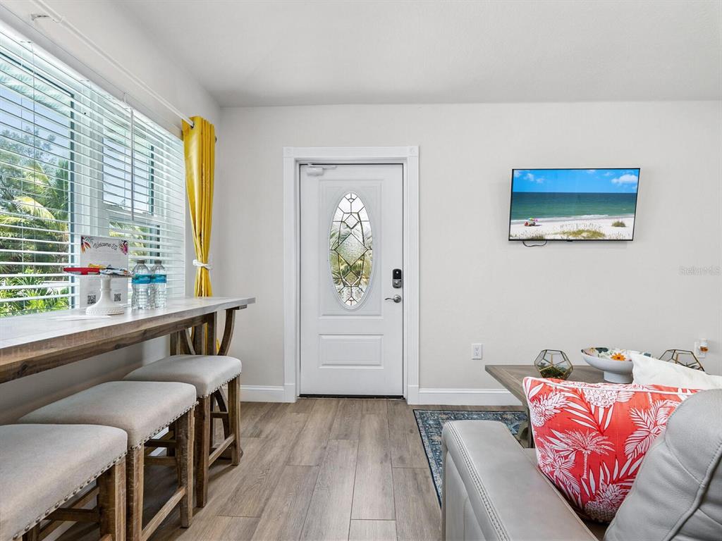 544 Canal Road Sarasota, FL 34242 - Photo 15 of 35 a bedroom with furniture and a window