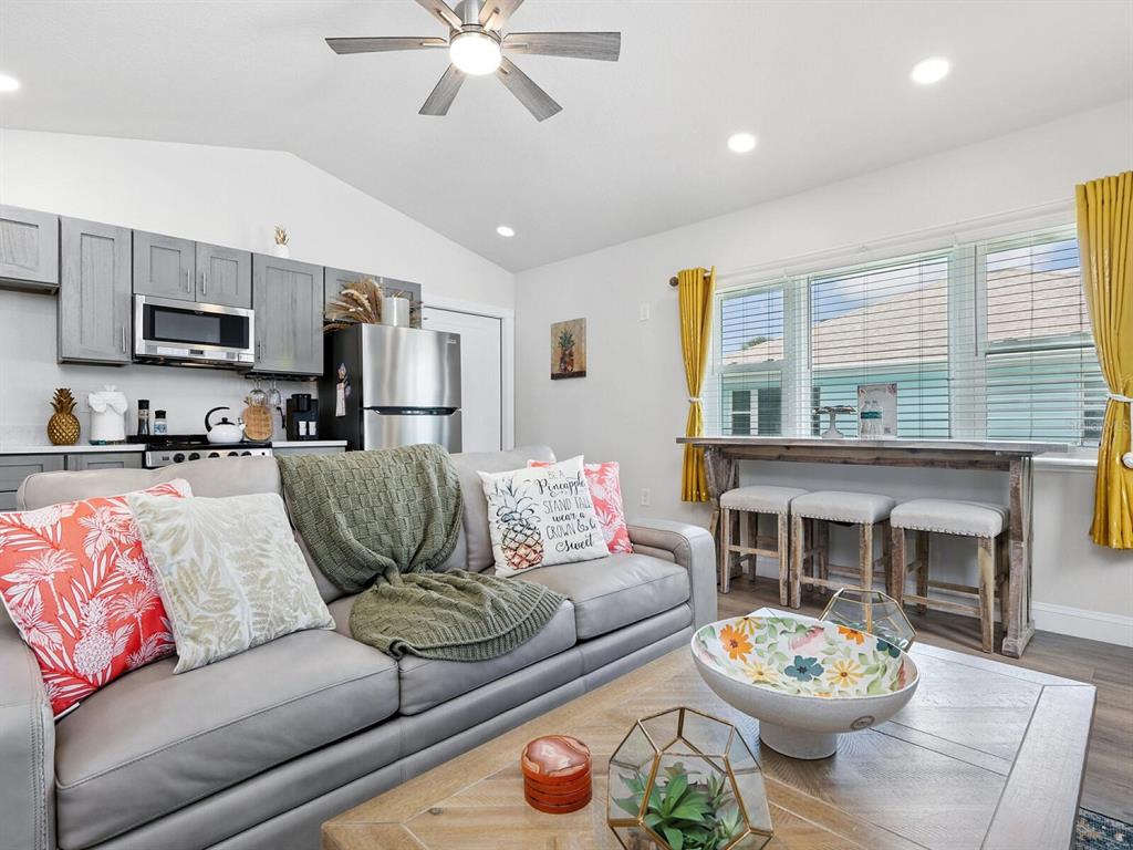 544 Canal Road Sarasota, FL 34242 - Photo 16 of 35 a living room with furniture and a kitchen