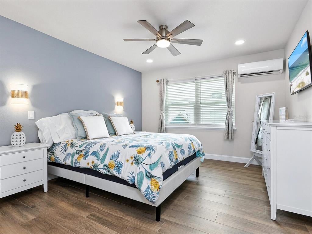 544 Canal Road Sarasota, FL 34242 - Photo 18 of 35 a bedroom with a large bed and a window